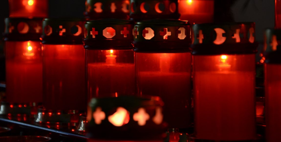 Grave_candles_in_a_church-1.jpg